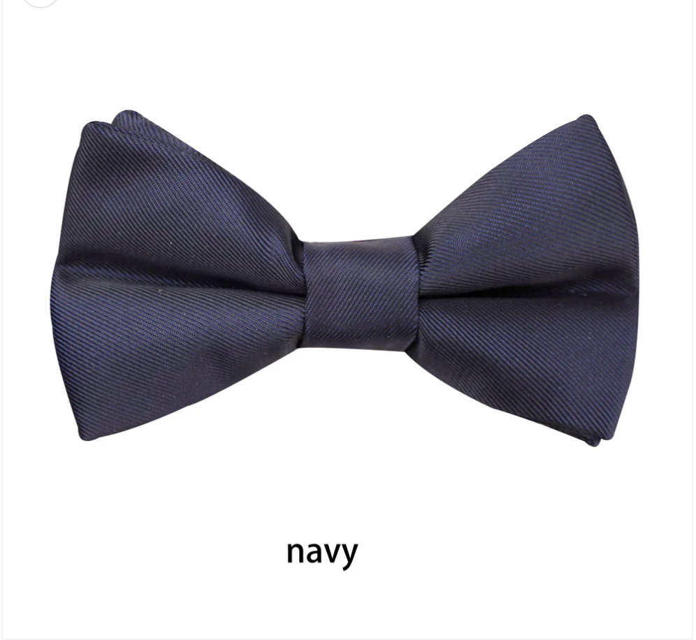**Boys Matte Bow Tie**

Complete the perfect formal look with our classic Boys Matte Black Bow Tie. Featuring a sophisticated matte finish, it's the ideal accessory for weddings, school formals, page boys, black-tie events, and special occasions.

* Elegant matte finish for a modern look
* Bow measures **8.5cm** across
* Adjustable neck strap with a **full length of 45cm**
* Comfortable, secure fit
* A timeless finishing touch for every young gentleman

Smart, stylish, and easy to wear—an essential ac