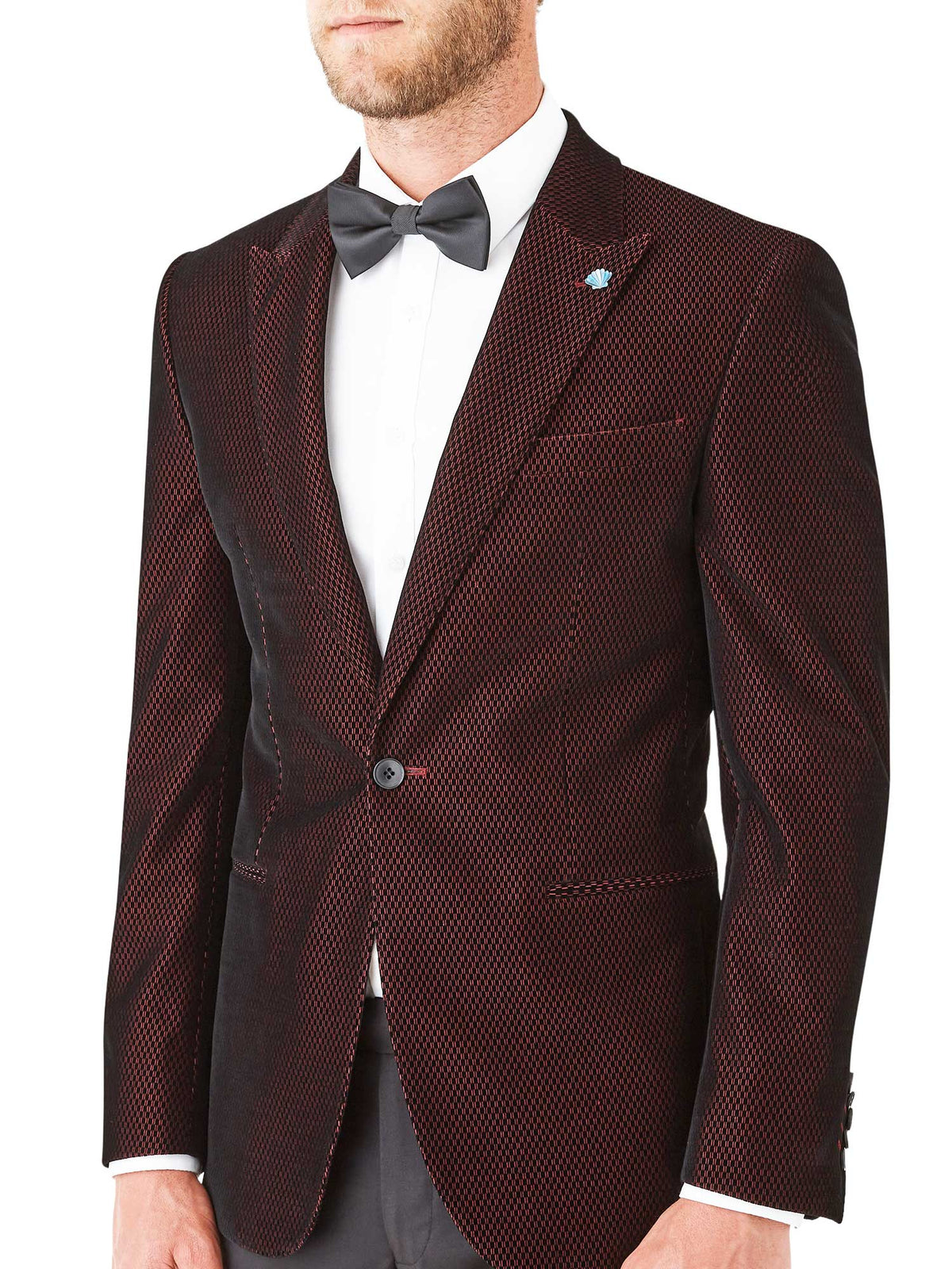 Crafted in Australia, the form-fitting Iconic Night Jacket showcases a burgundy velvet with a striking geometric pattern. Combine with black pants and a white or black blouse for an elegant and refined evening ensemble.
